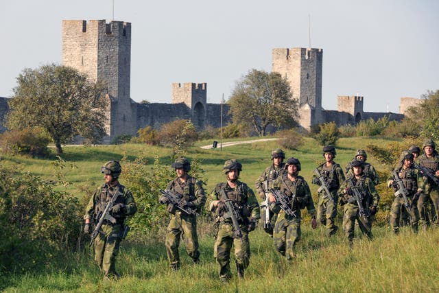 Swedish troops patrol outside Visby, on Gotland island, Sweden