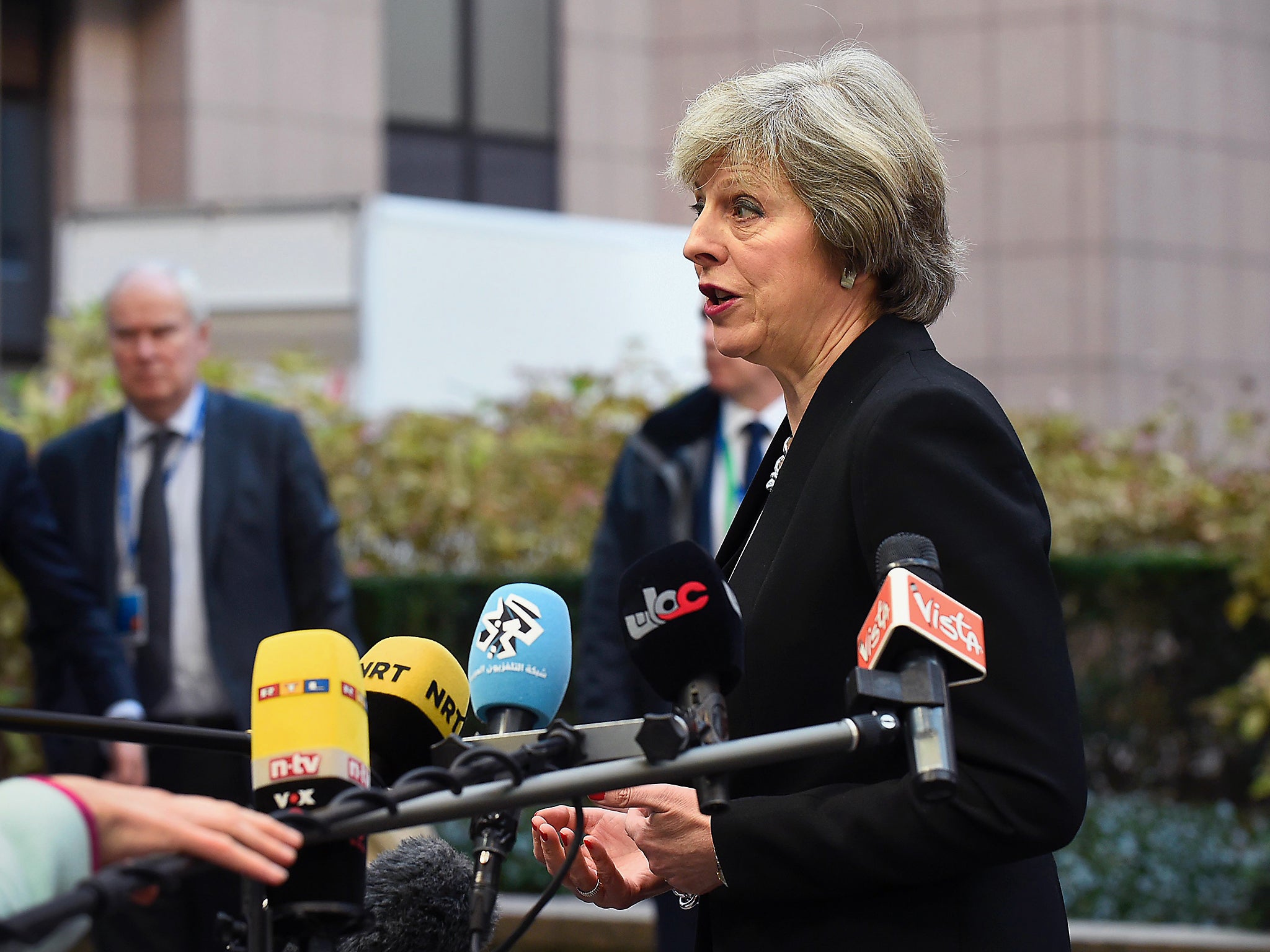 British Prime Minister Theresa May adresses the media as she arrives for a European Union leaders summit focused on Russia sanctions and migration at the European Council in Brussels