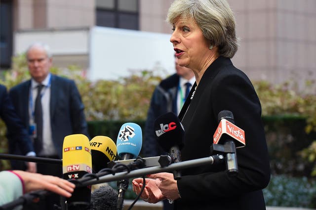 British Prime Minister Theresa May adresses the media as she arrives for a European Union leaders summit focused on Russia sanctions and migration at the European Council in Brussels