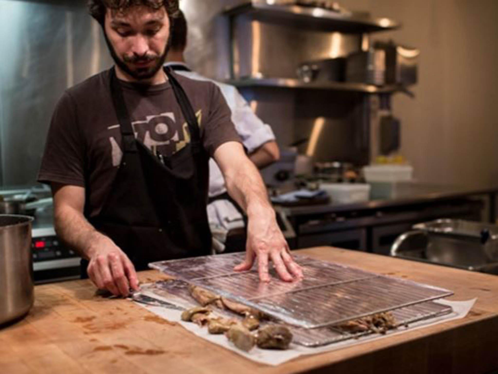 The meat is collected between two boards, pressed and chilled overnight. Then it is reheated and fried on a plancha over a low heat until the fat renders down and the skin crisps up