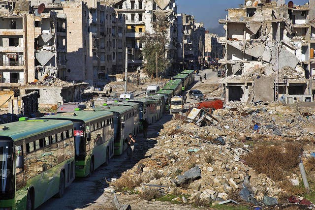 Buses are seen during an evacuation operation of rebel fighters and their families  from rebel-held neighbourhoods in the embattled city of Aleppo