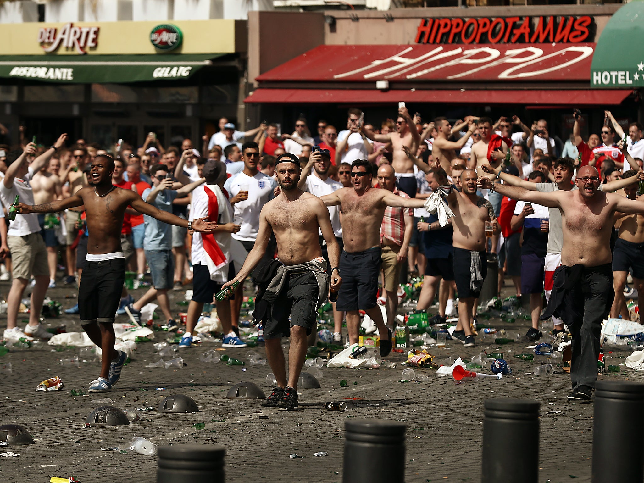 England fans throw bottles and clash with police ahead of a game against Russia in June