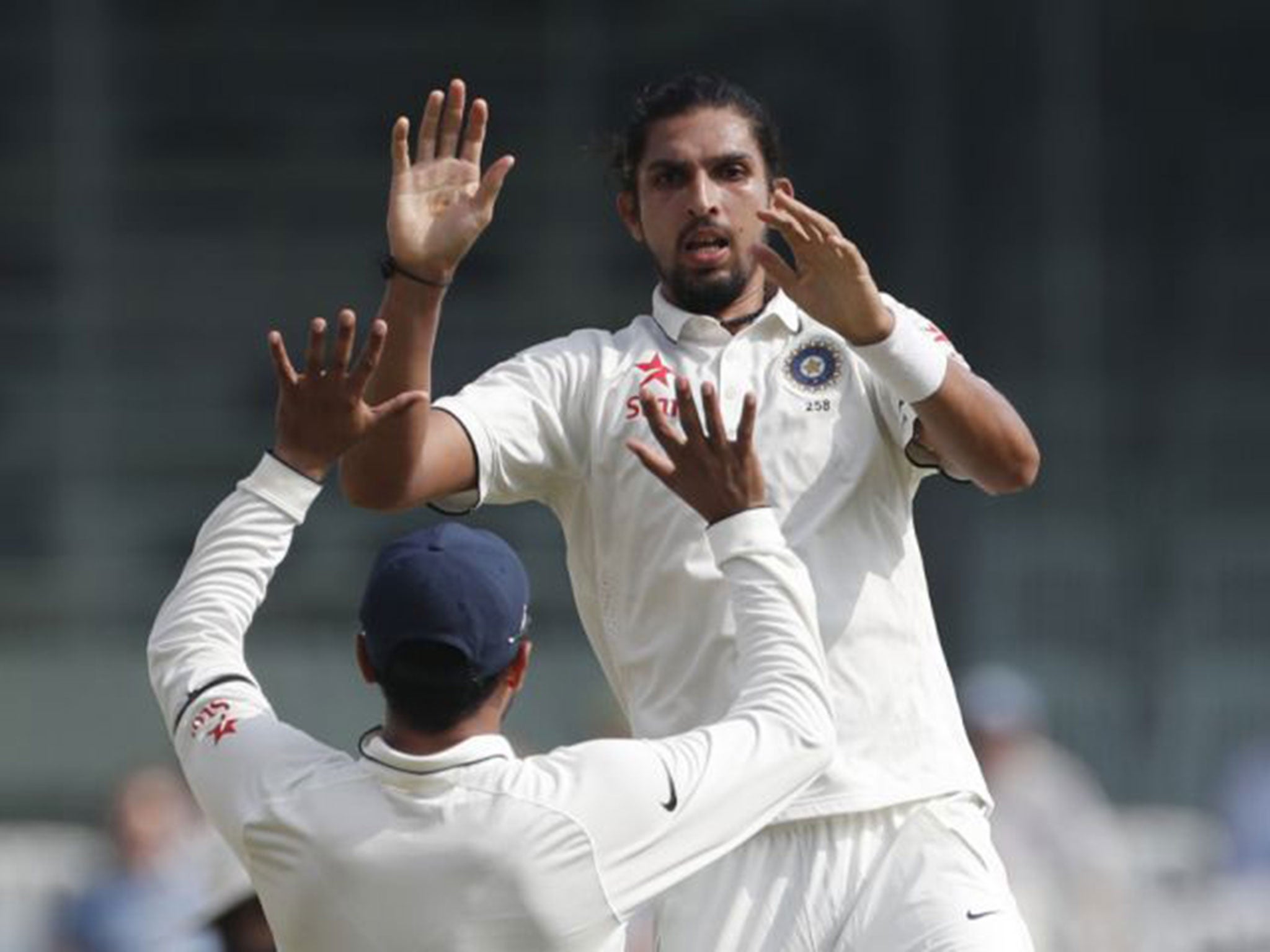 Ishant Sharma celebrates taking the wicket of Keaton Jennings for one run
