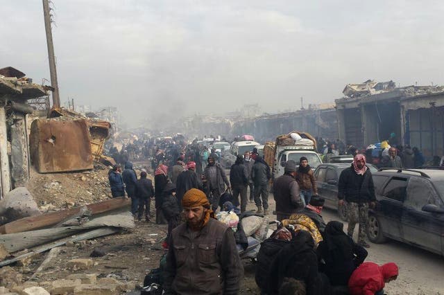 Those left in east Aleppo report confusion as thousands wait for evacuations in freezing weather