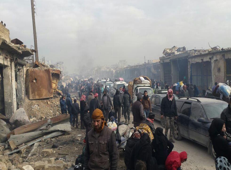 Those left in east Aleppo report confusion as thousands wait for evacuations in freezing weather