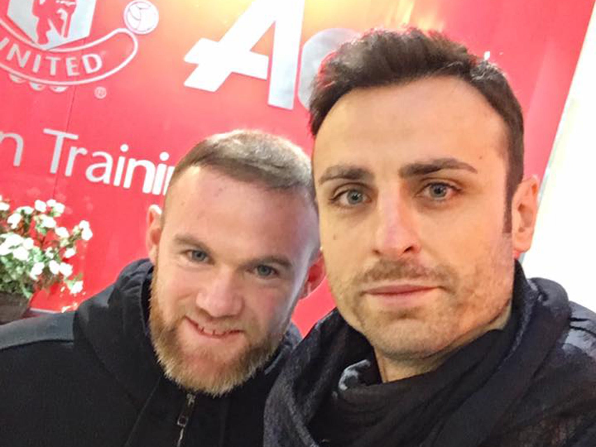 Berbatov poses with Rooney, his former strike partner at United