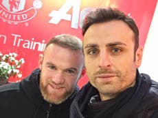 Berbatov confirms United return with Rooney photograph