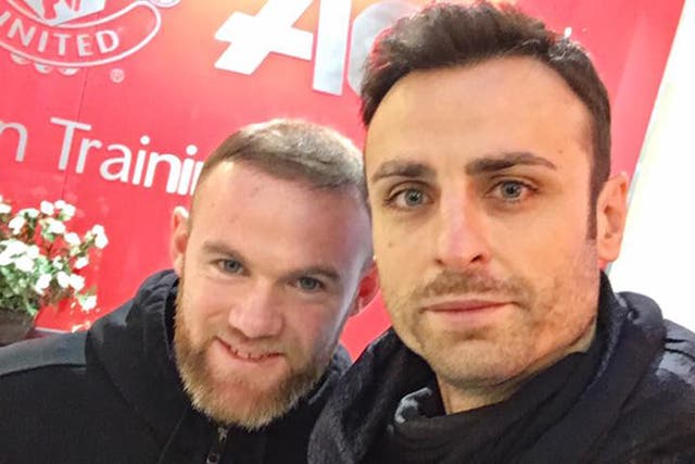 Berbatov poses with Rooney, his former strike partner at United