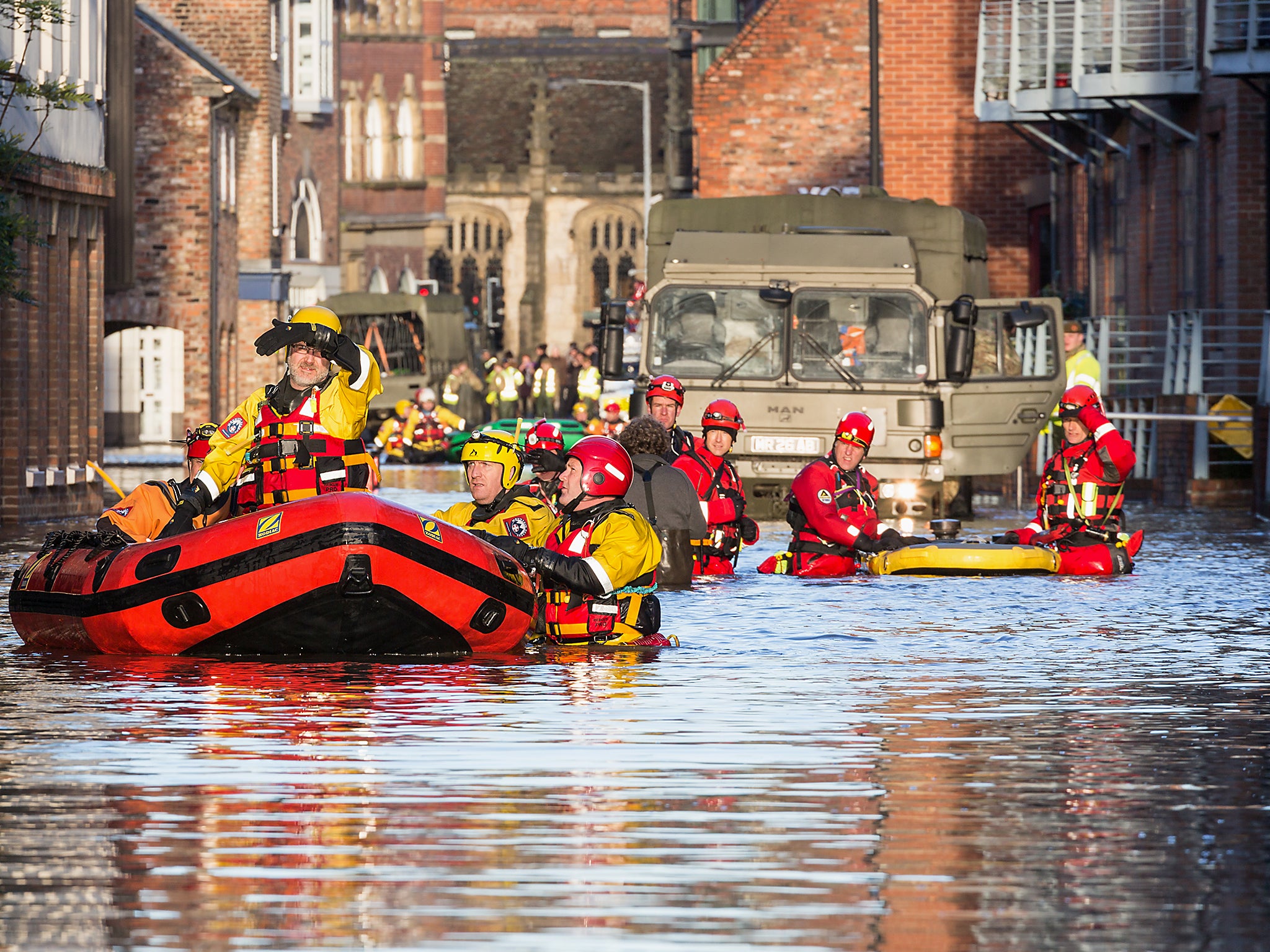 Rescue teams in York attend the scene of a flood in 2015