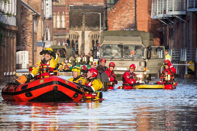 Rescue teams in York attend the scene of a flood in 2015