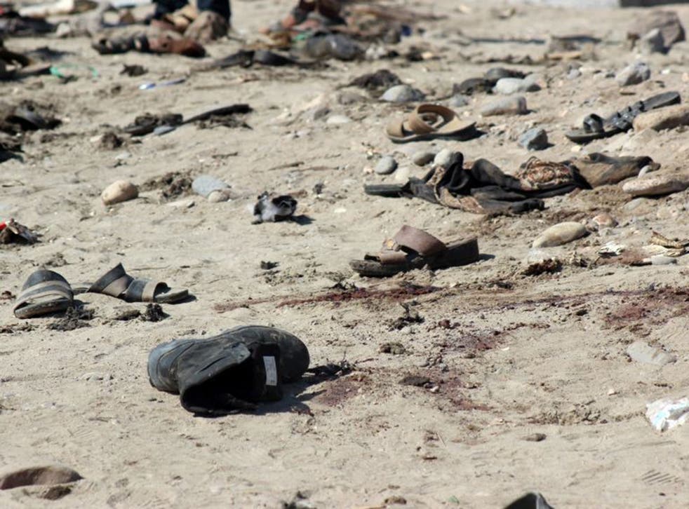 Shoes seen at the site of the suicide bombing which killed at least 48 people in Aden