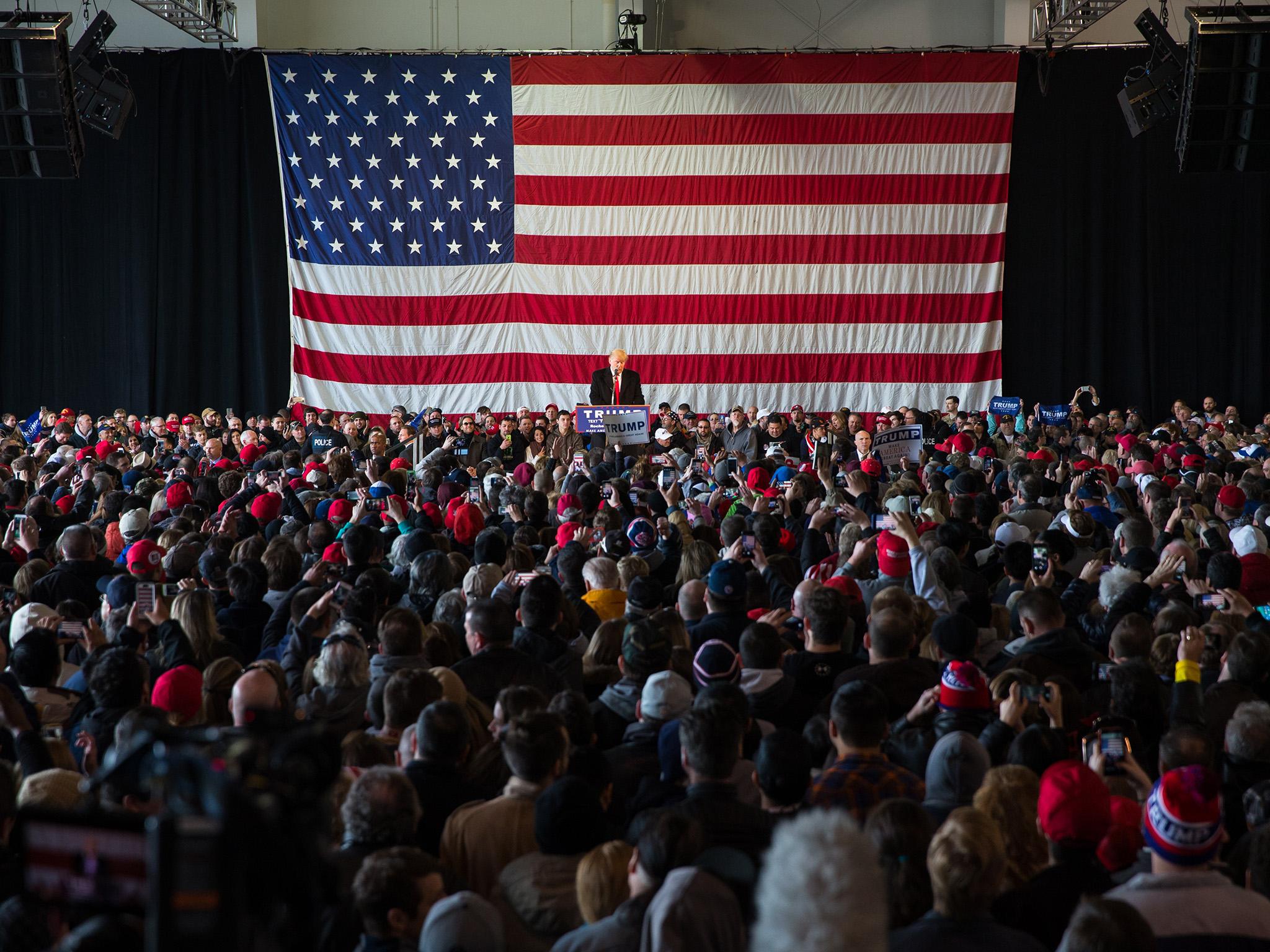 Donald Trump speaks in front of a capacity crowd at a rally for his campaign in Rochester, New York