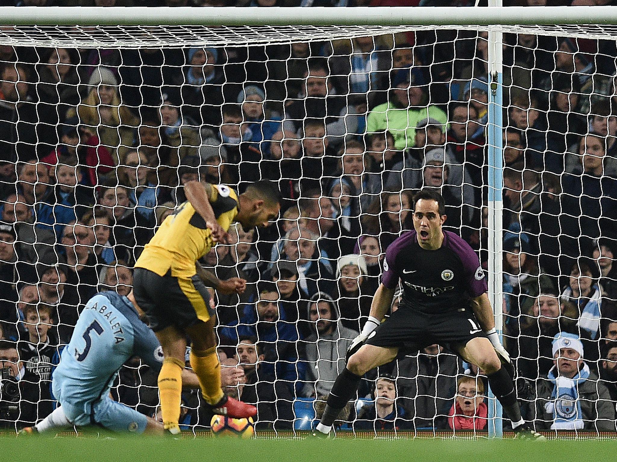 Bravo committed himself early as Walcott delicately tucked the ball away