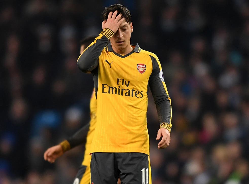 Mesut Özil reacts at the full-time whistle as Arsenal lost 2-1 to Manchester City