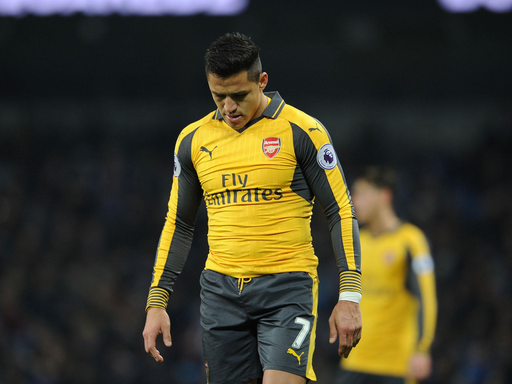 Alexis Sanchez looked dejected after Arsenal's capitulation in the 2-1 loss to Manchester City