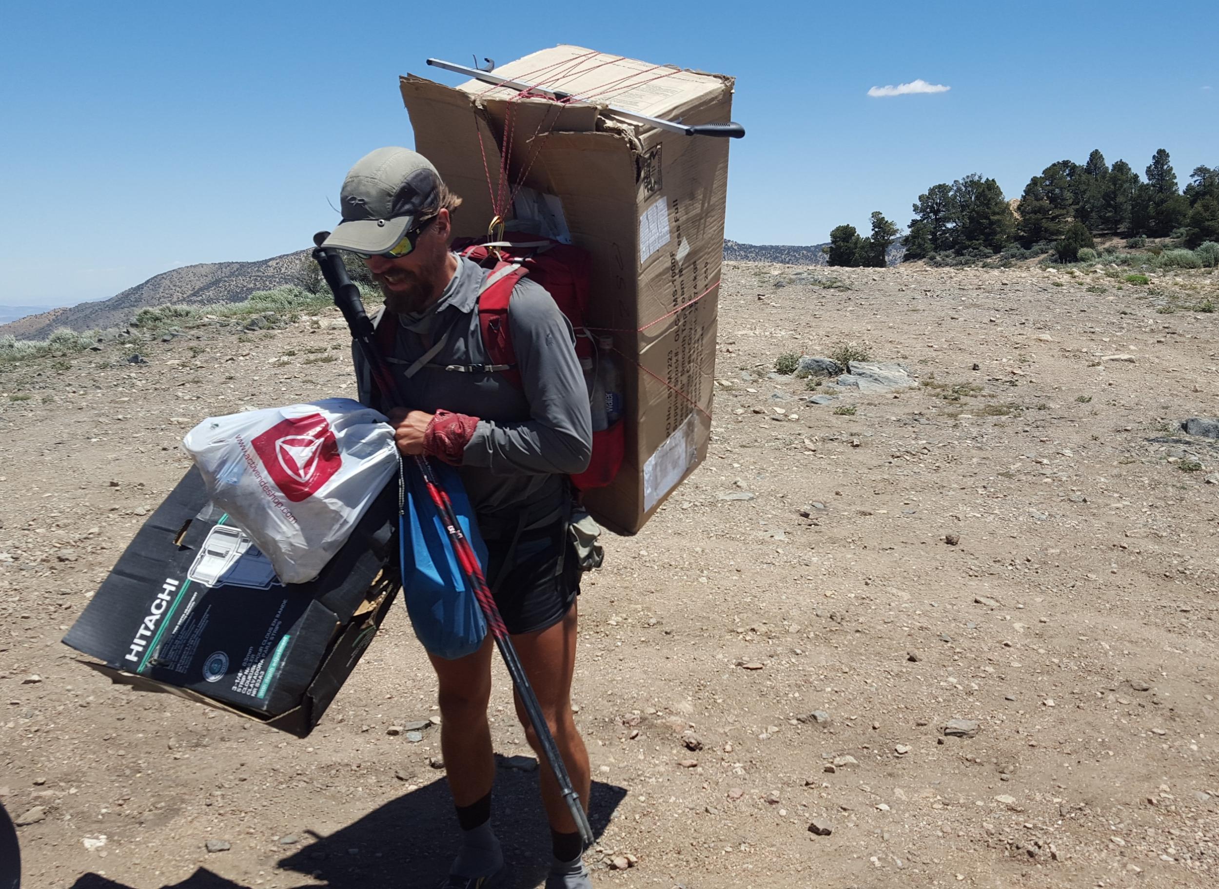 Seth Orme hikes with rubbish on his back until he can find a proper place to dispose of it