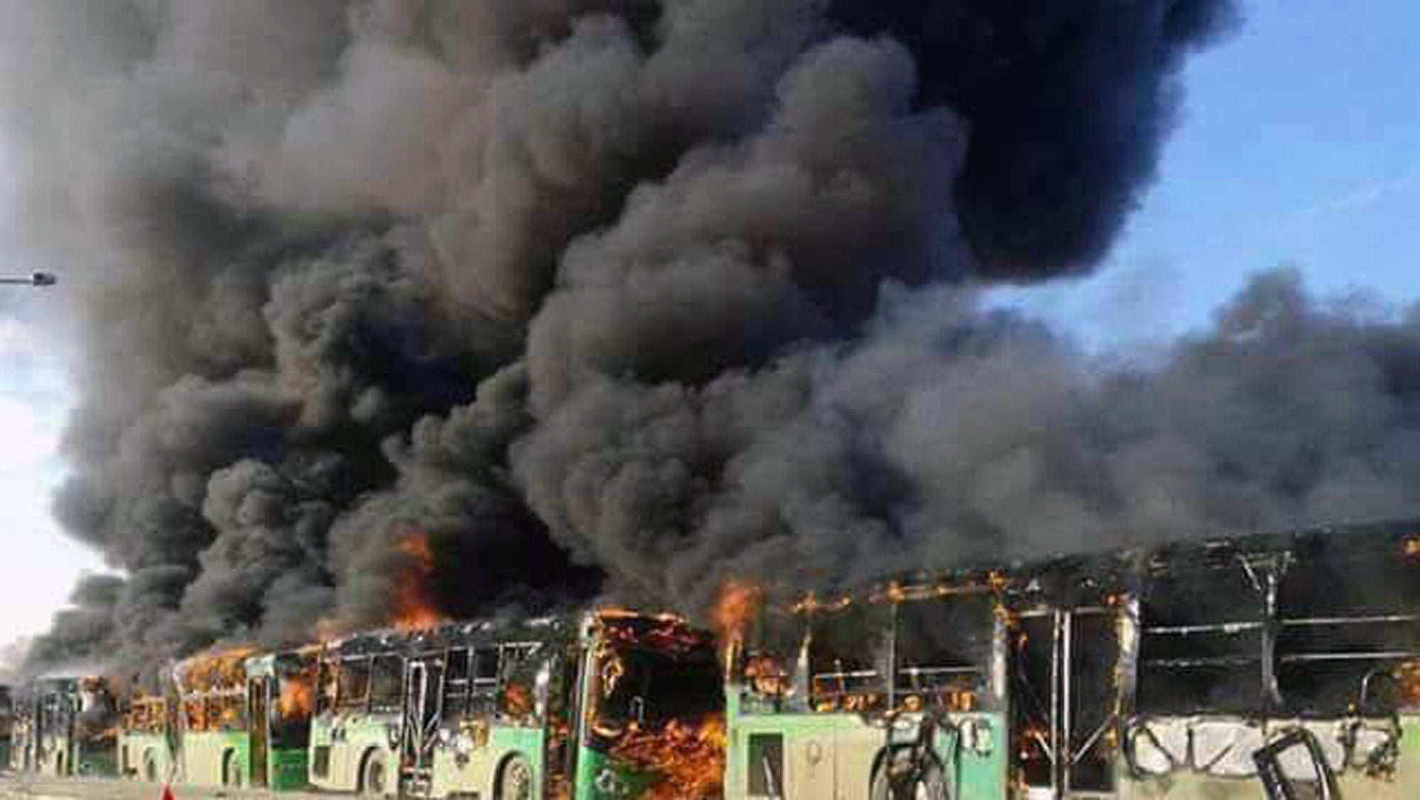 Syrian activists said militants have burned at least five buses assigned to evacuate wounded and sick people