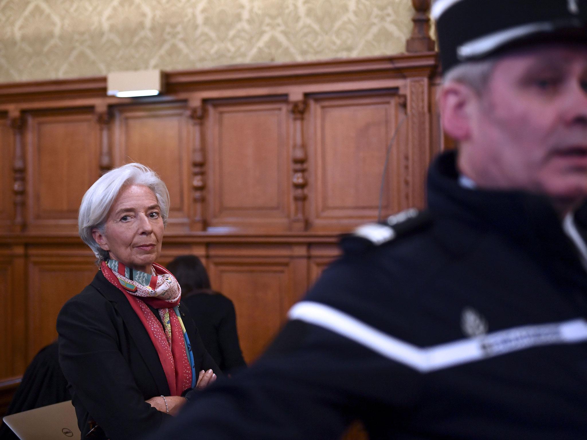 IMF chief Christine Lagarde protested her innocence through tears on Friday