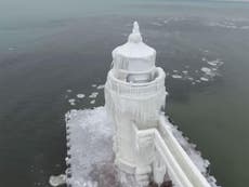 Stunning images capture frozen lighthouse on Lake Michigan
