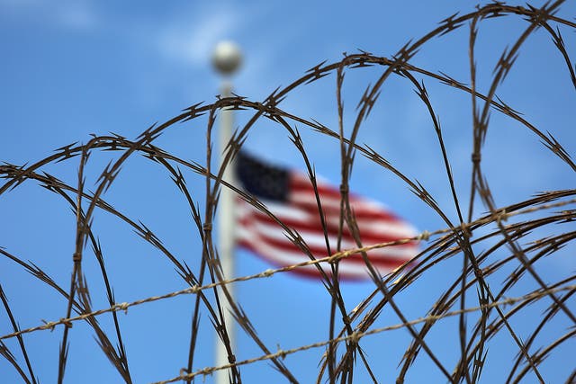 Razor wire tops the fence of the US prison at Guantanamo Bay
