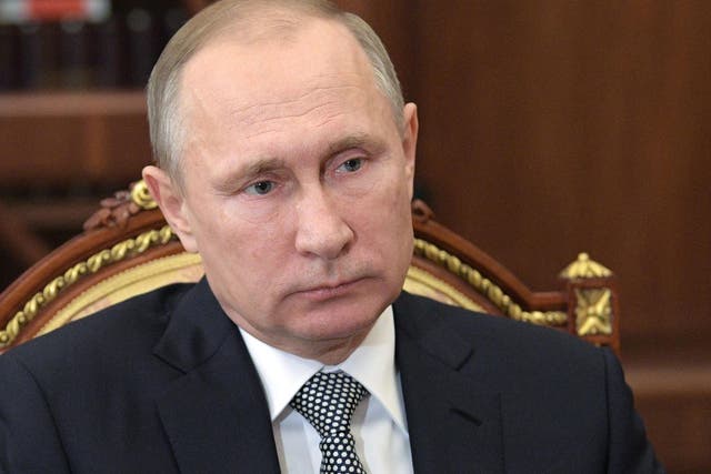 Vladimir Putin says the killing of Andrey Karlov was intended to derail the Syria peace process