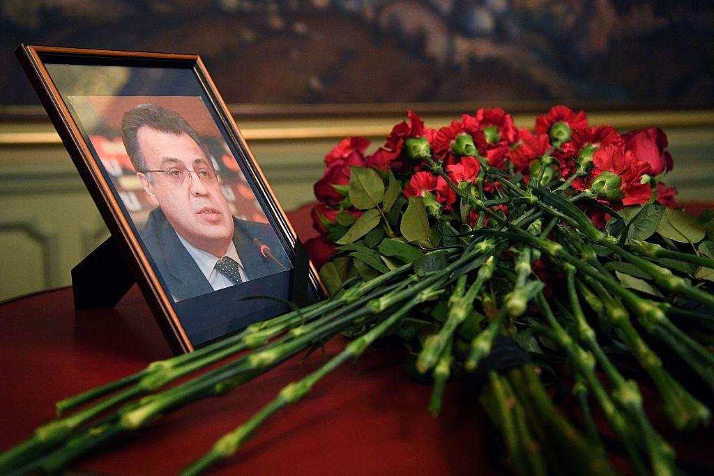 lowers are placed in front of a portrait of Russian Ambassador to Turkey Andrei Karlov in the Foreign Ministry in Moscow on December 20, 2016, a day after he was assassinated