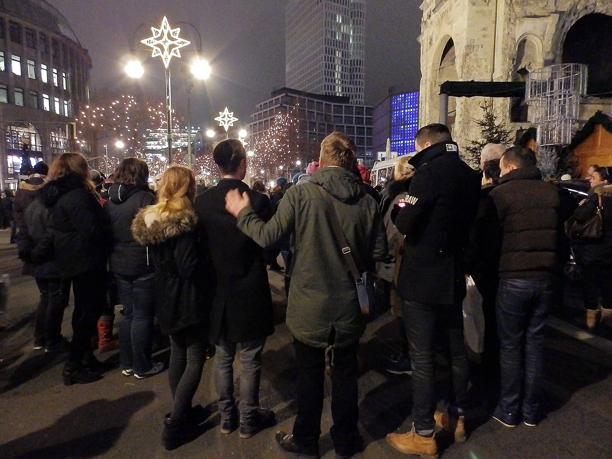 People take part in a vigil in Berlin, Germany after the truck attack at the Christmas market