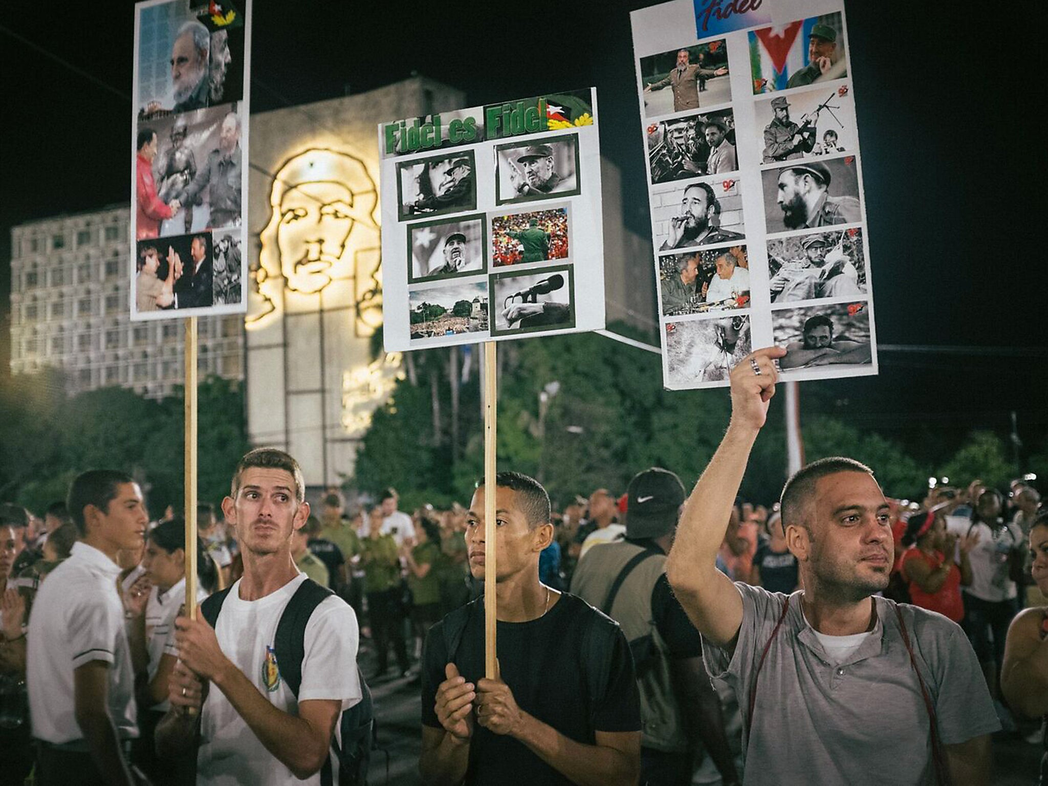 Homemade placards at a mass eulogy held in the Plaza de la Revolución in Havana