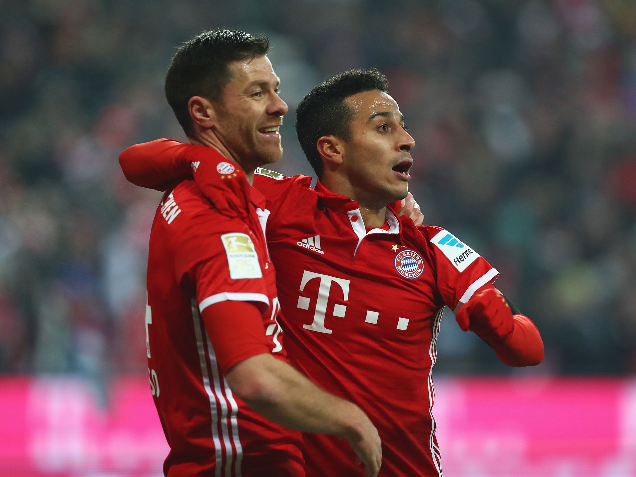 Xabi Alonso and Thiago Alcantara celebrate during Bayern Munich's 3-0 win over Leipzig