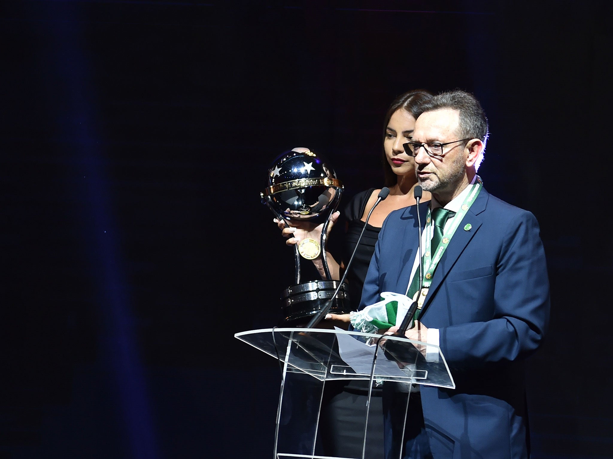 Chapecoense president Plinio David holds the Copa Sudamericana trophy