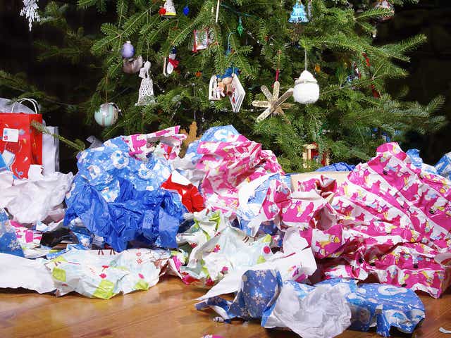 Wrapping paper scattered under the Christmas tree