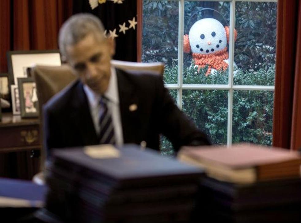 An unsuspecting Barack Obama and a snowman