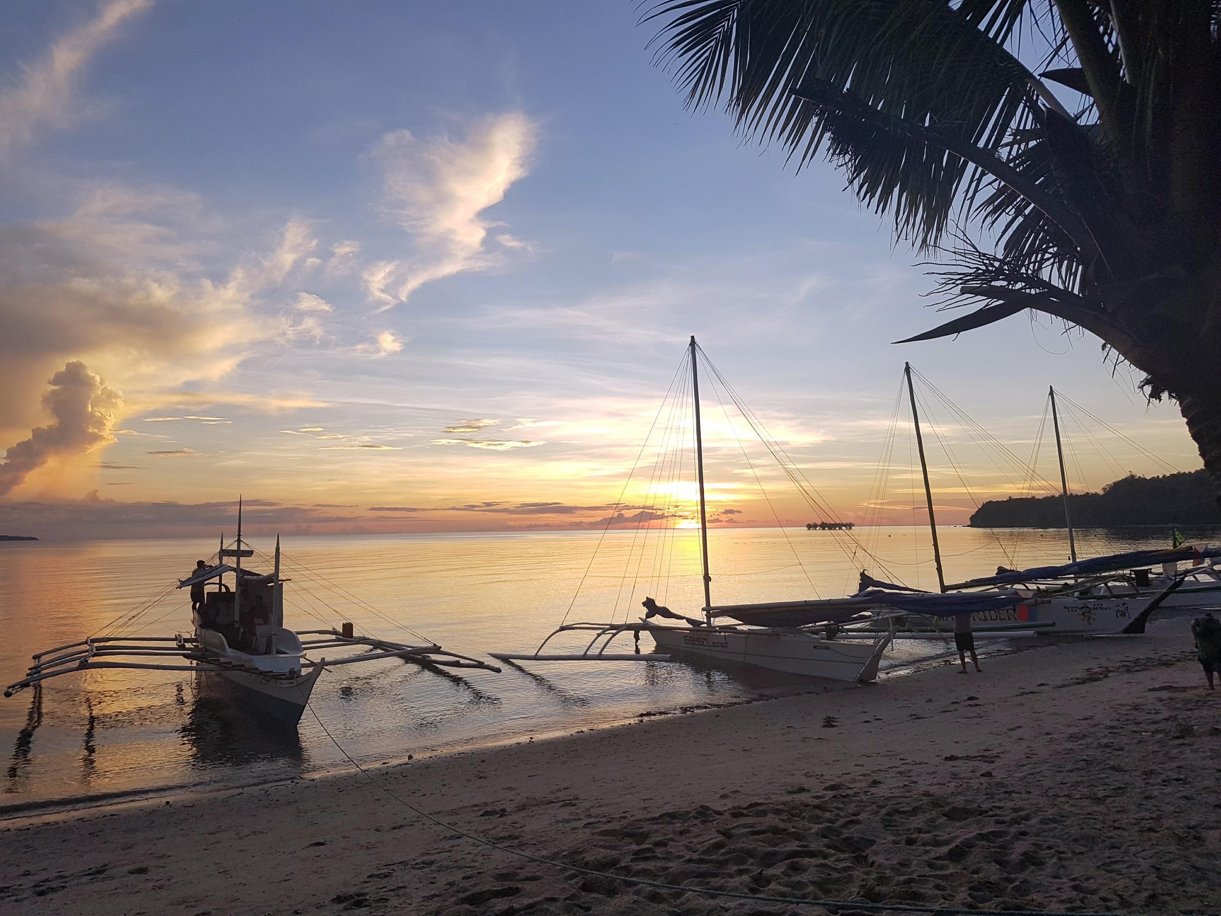 Locals use traditional paraw boats to get around from island to island