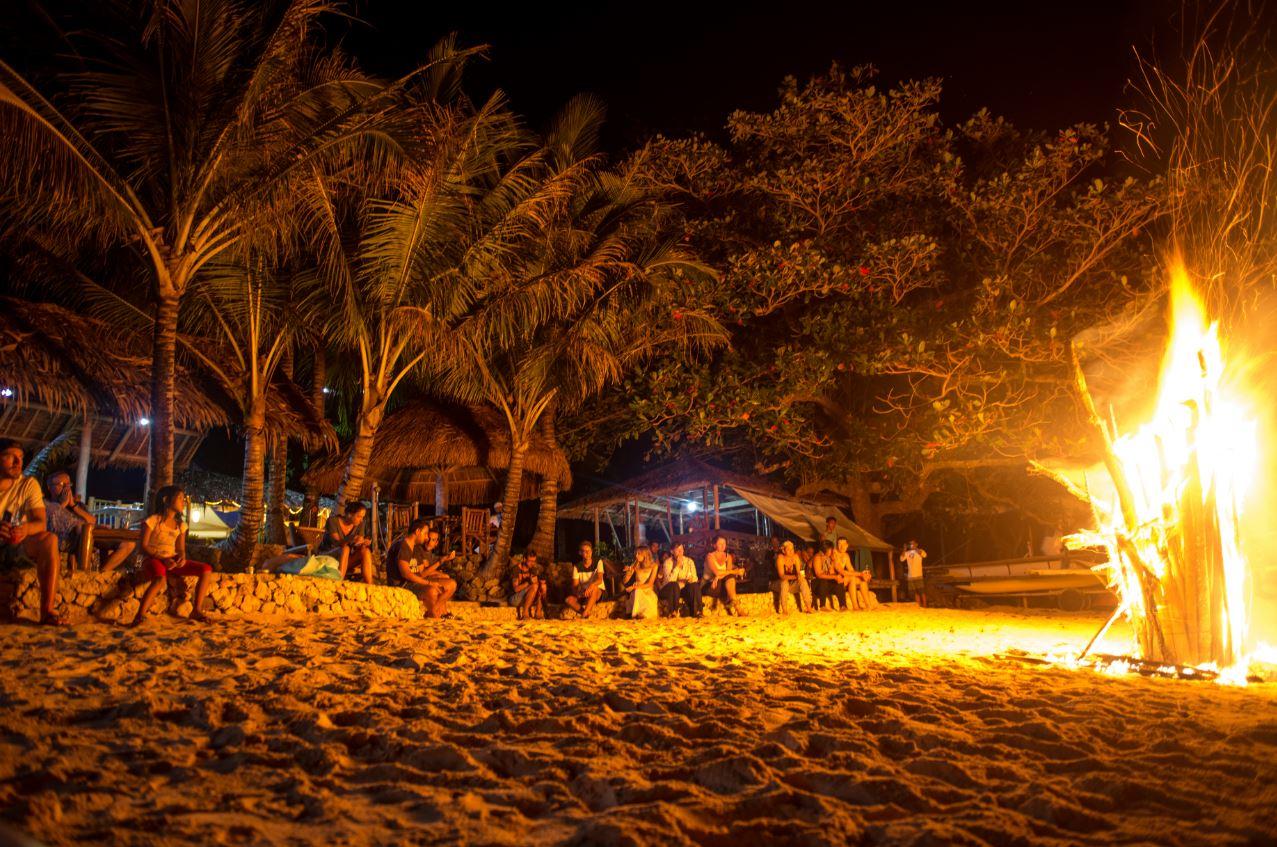 Unwind with a beach bonfire, after a grueling day adventuring