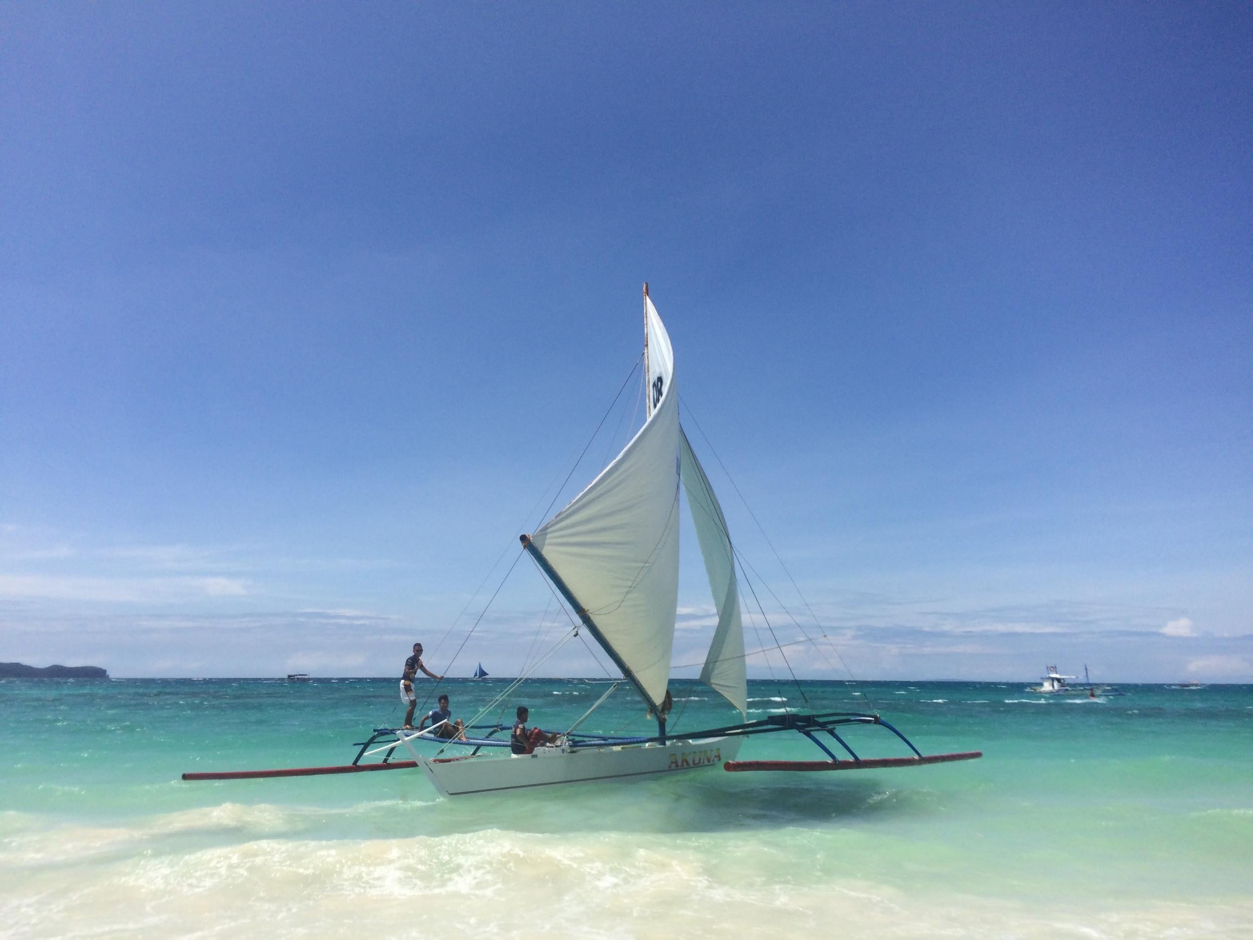 Race across turquoise seas in traditional paraw boats
