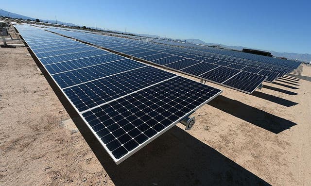 Rows of solar panels operate during a dedication ceremony to commemorate the completion of the 102-acre, 15-megawatt Solar Array II Generating Station at Nellis Air Force Base on February 16, 2016 in Las Vegas, Nevada.