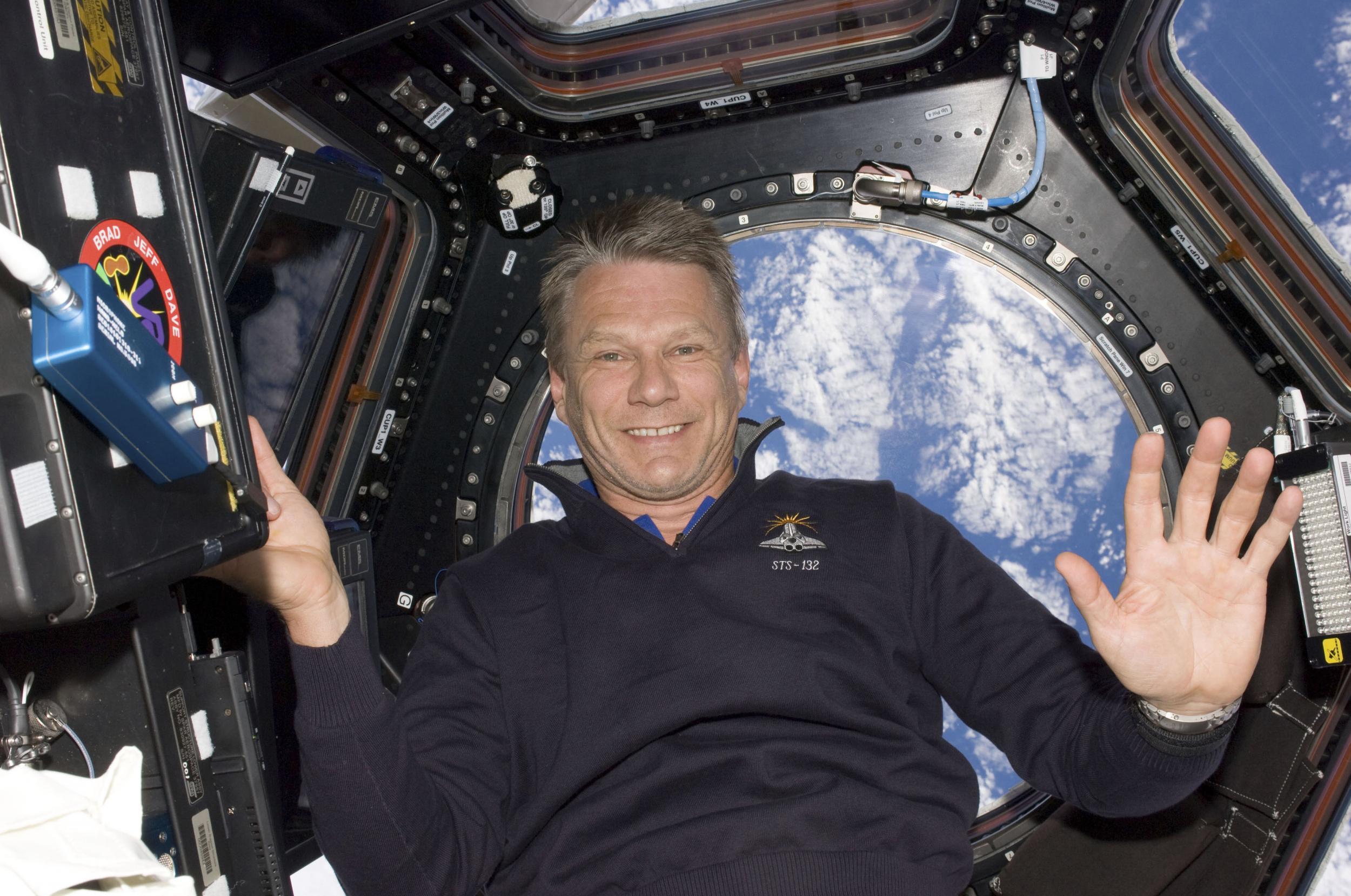 Astronaut Piers Sellers poses for a photo in the International Space Station in 2010