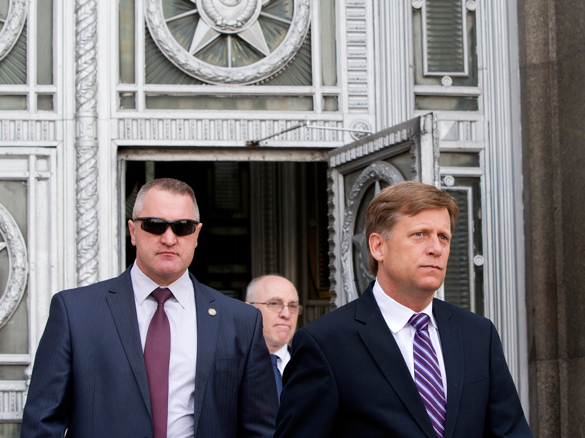 Michael McFaul (right) leaves the Russian Foreign Ministry headquarters in Moscow in 2013