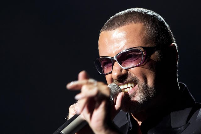 <p>British singer George Michael performs on stage during a charity gala in 2012</p>