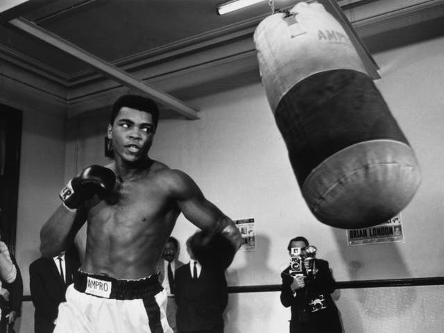 Muhammad Ali training with a punchbag in August 1966