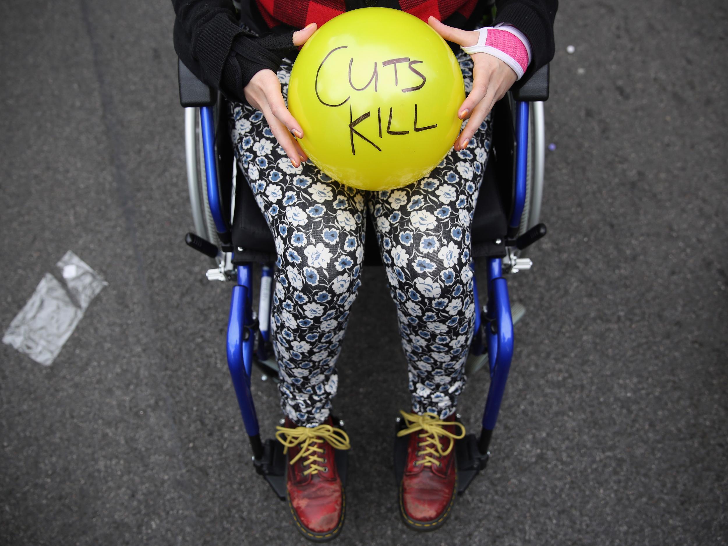 Anti-austerity protesters prepare to throw balls towards Downing Street in protest against the 2015 budget