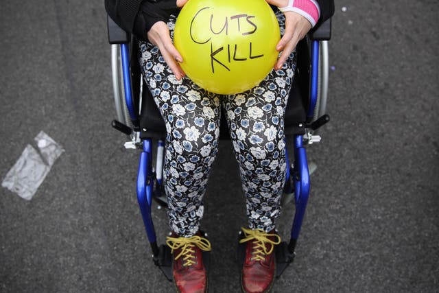 Anti-austerity protesters prepare to throw balls towards Downing Street in protest against the 2015 budget