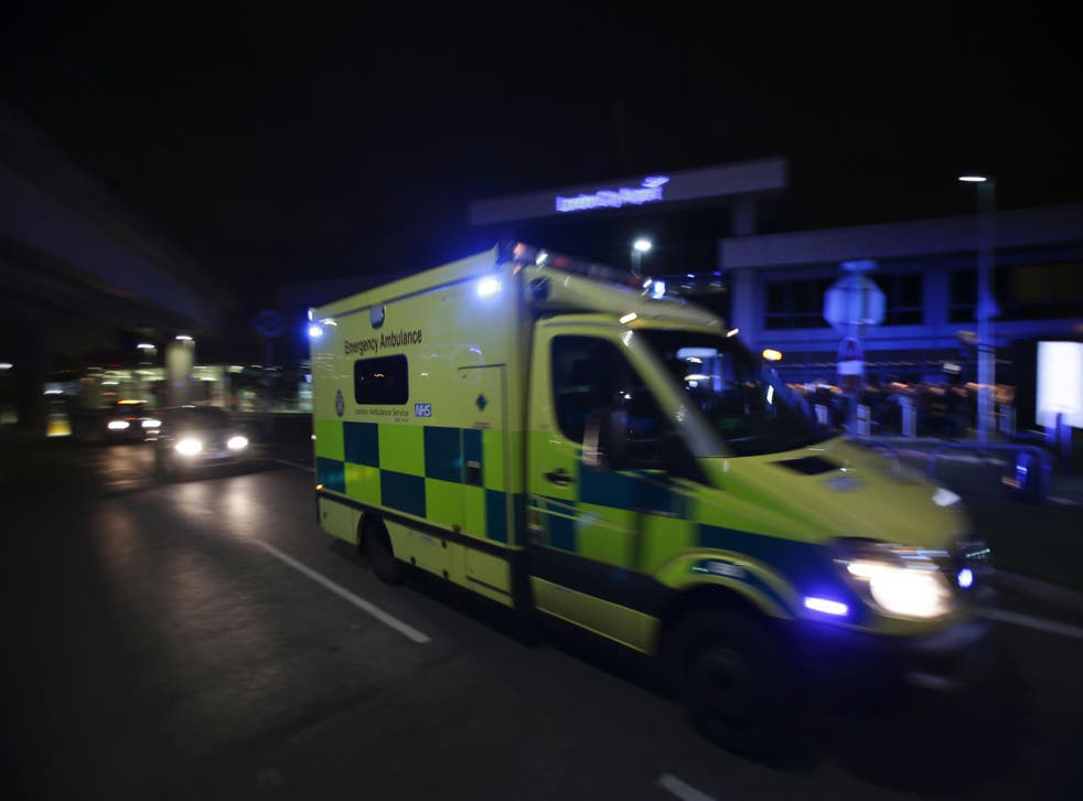An Ambulance drives past London's City Airport