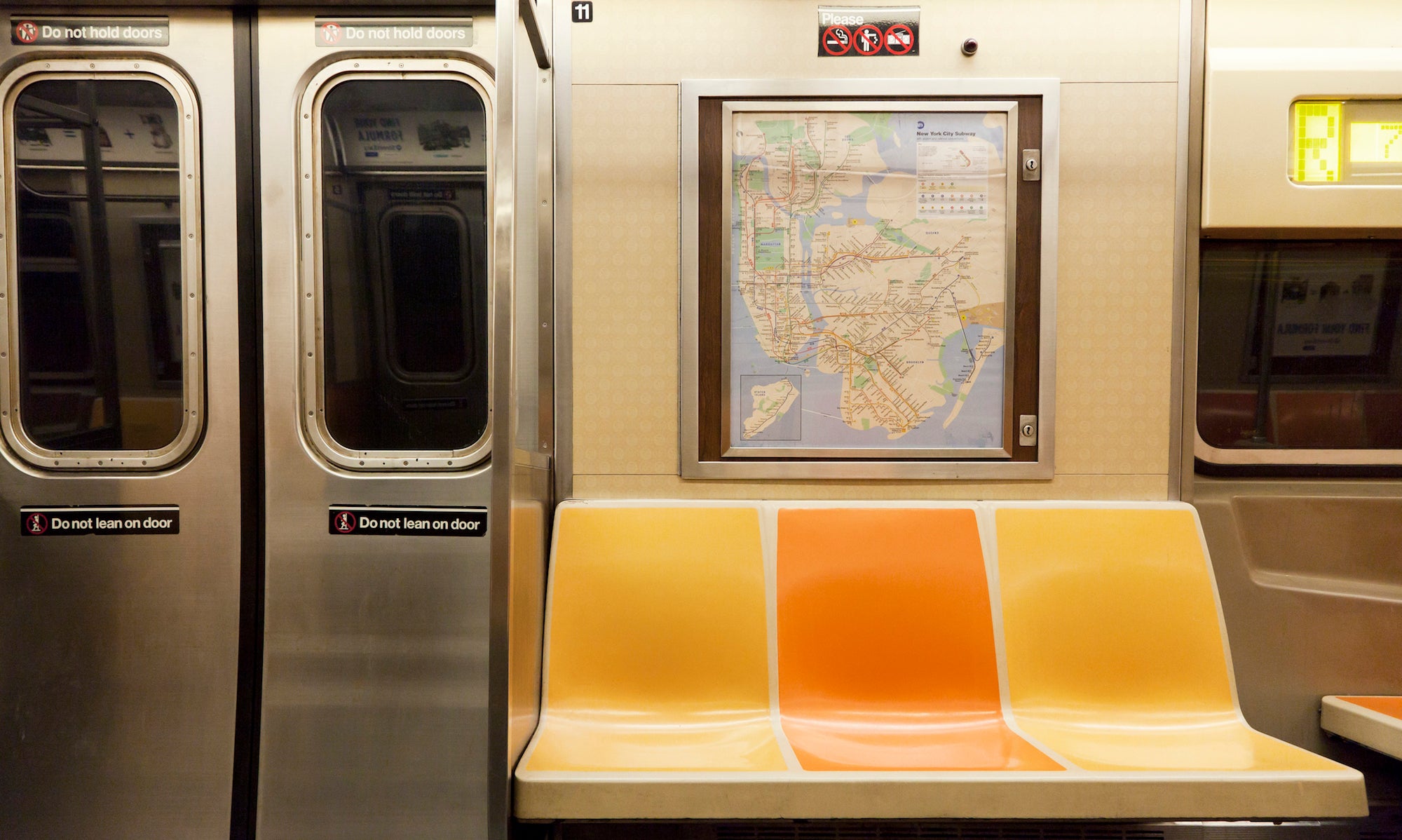 New York, NY, USA - March 15, 2016: Inside of subway wagon: Colorful seats and inside of empty car: The NYC Subway is one of the oldest and most extensive public transportation systems in the world.