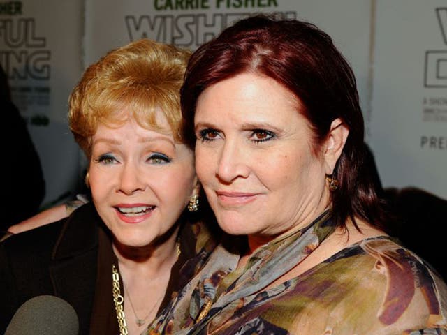 Debbie Reynolds (left) and her daughter Carrie Fisher arrive at a premiere in Hollywood, 2010