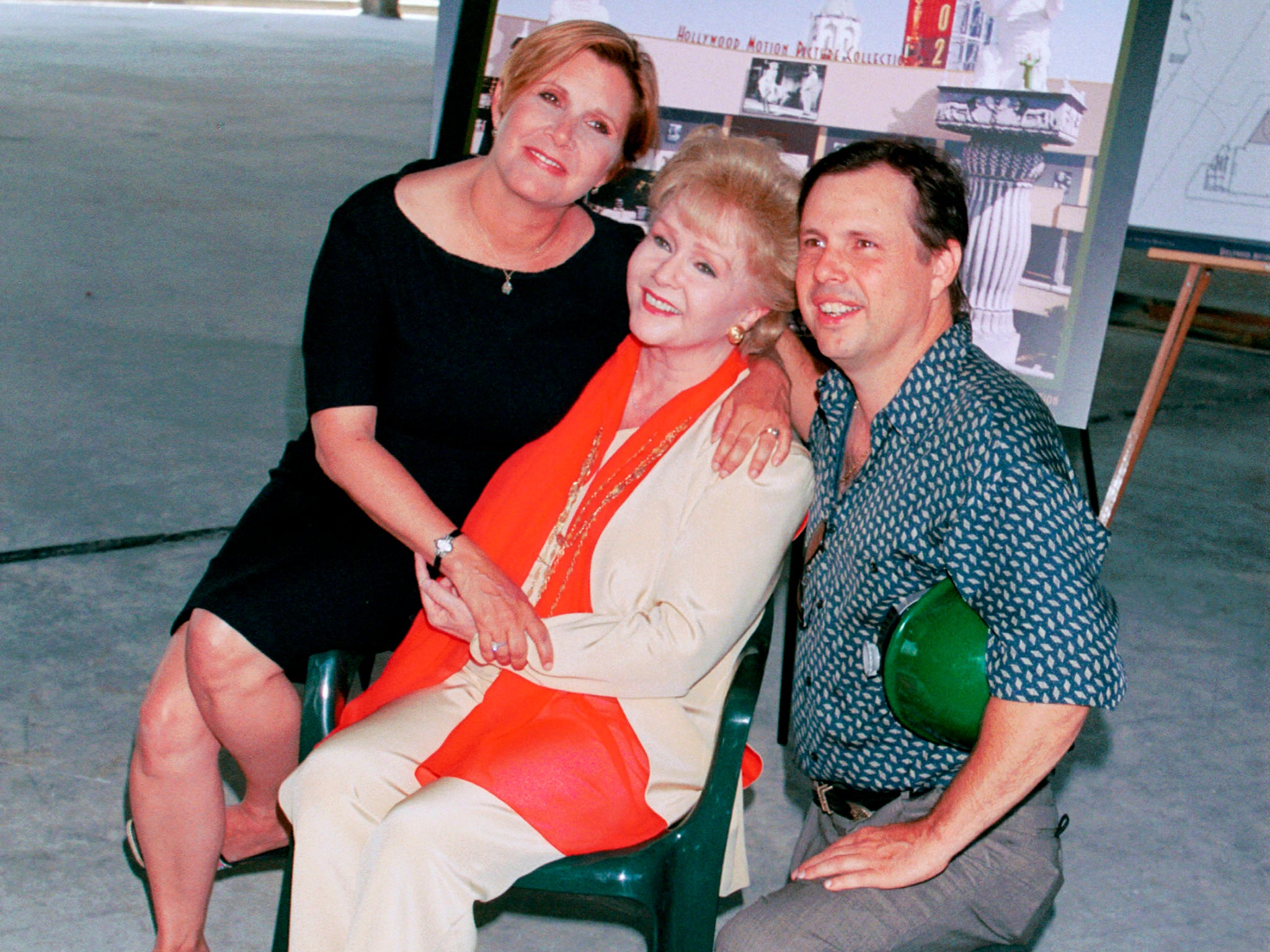 Actress Debbie Reynolds, poses with her children Carrie Fisher and Todd Fisher