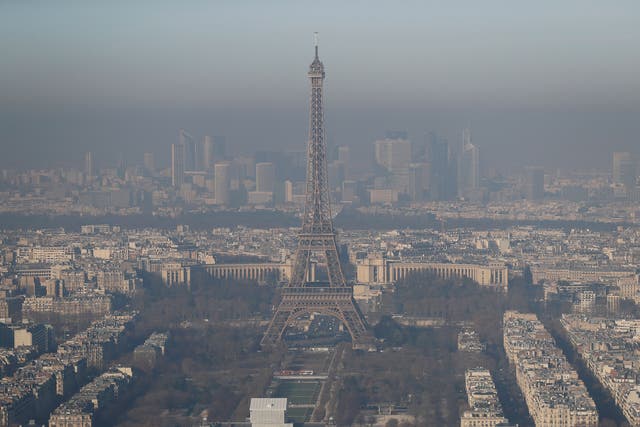 A picture taken on 5 December 2016 shows the Eiffel Tower in the smog
