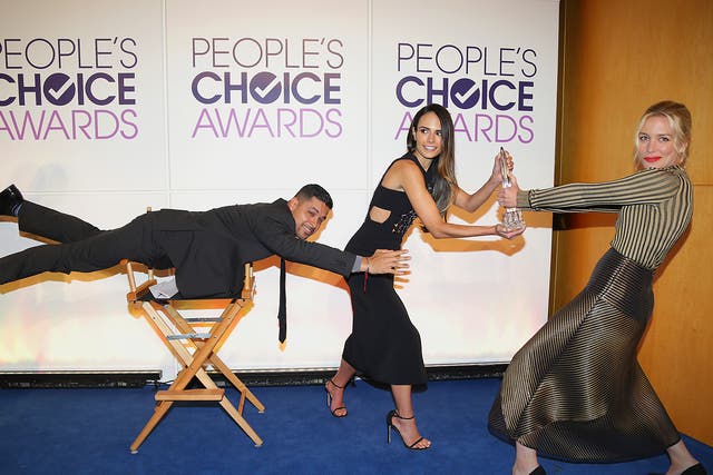 Wilmer Valderrama, Jordana Brewster and Piper Perabo fight over an award as part of the #MannequinChallenge during People's Choice Awards Nominations Press Conference