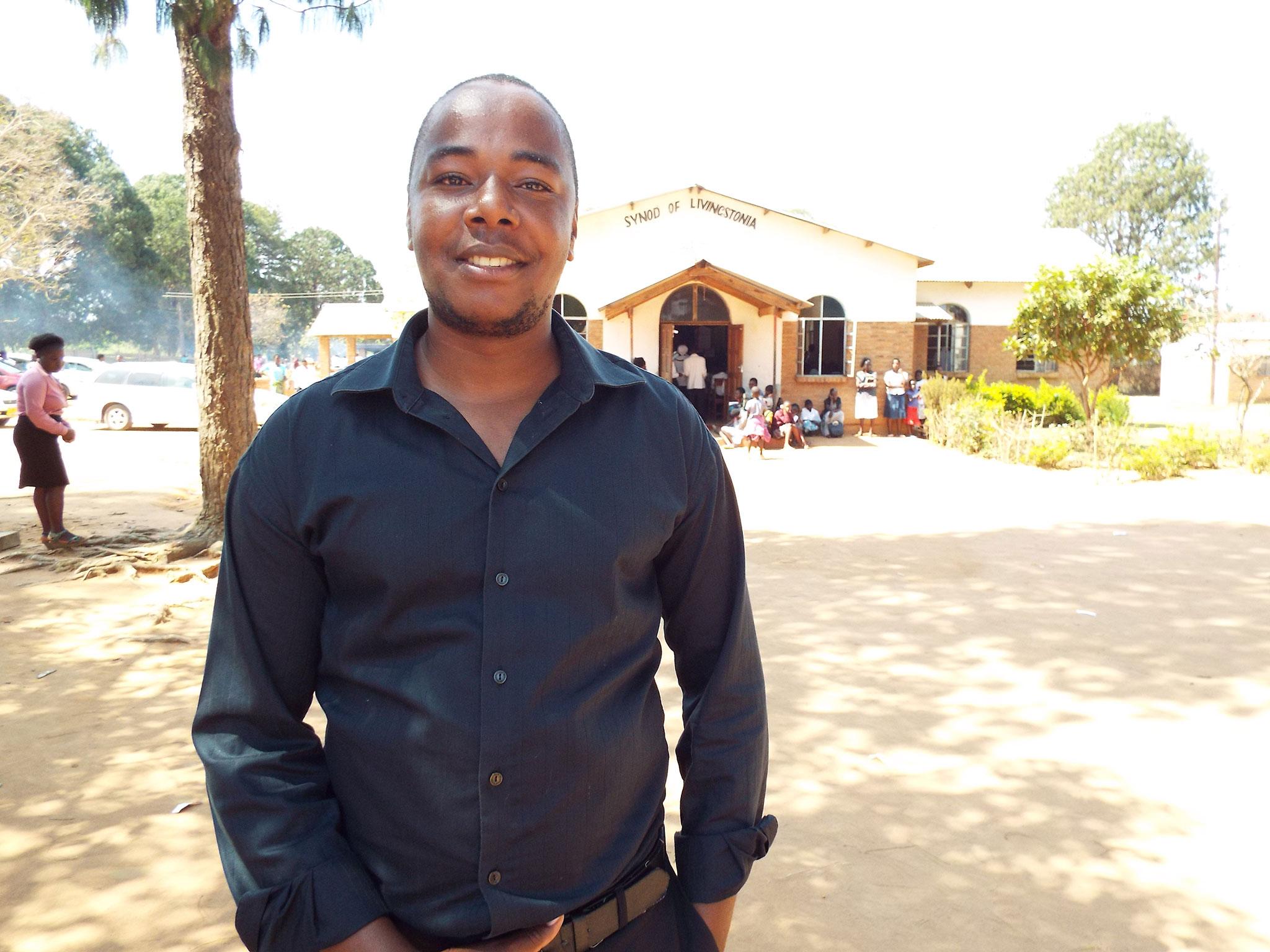 Chatonda, standing outside his church in Mzuzu, Malawi, has tried to run workshops with NGOs