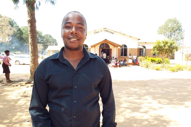 Chatonda, standing outside his church in Mzuzu, Malawi, has tried to run workshops with NGOs